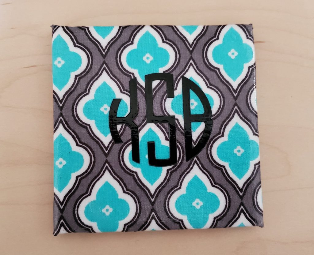 DIY coasters with tiles covered in fabric with monogram
