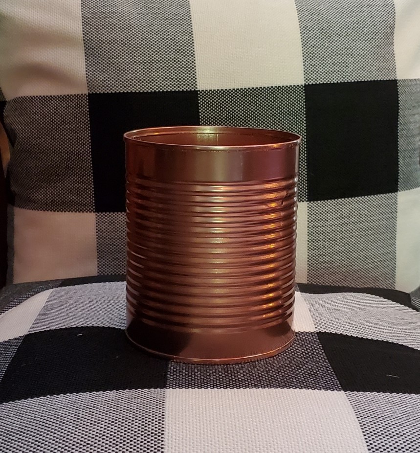 TIn can painted bronze