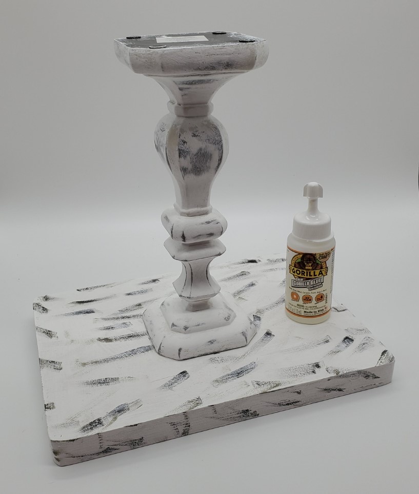 glue candlestick to tray